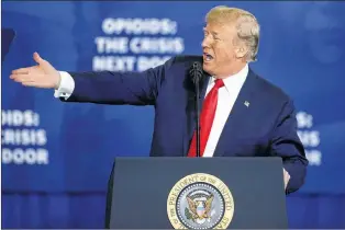  ?? AP FILE ?? U.S. President Donald Trump gestures as h speaks about his plan to combat opioid drug addiction at Manchester Community College, Monday, March 19, 2018, in Manchester, N.H.