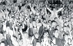  ??  ?? Merthyr fans celebrate after their team’s 1-0 victory in the 1987 Welsh Cup final