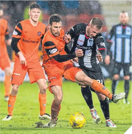  ??  ?? Dundee United’s Tony Andreu challenges Dunfermlin­e’s John Herron.