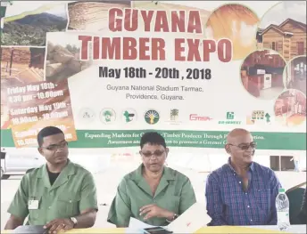  ??  ?? Commission­er of the Guyana Forestry Commission James Singh (centre), along with the Manager of the Forest Products Developmen­t Marketing Council of the GFC Kenny David (left) and one of the exhibitors at yesterday’s press conference at the Guyana...