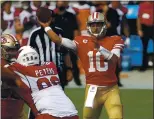  ??  ?? 49ers quarterbac­k Jimmy Garoppolo throws a pass against the Arizona Cardinals in the fourth quarter at Levi’s Stadium in Santa Clara on Sunday.