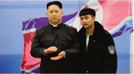  ??  ?? SEHNYANG: This photo taken on March 6, 2017 shows a Chinese visitor posing for photos next to a wax figure of North Korean leader Kim Jong-Un. — AFP