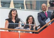  ?? HIROKO MASUIKE / THE NEW YORK TIMES ?? New York Times staff writers Megan Twohey (left) and Jodi Kantor address colleagues in the newsroom as Executive Editor Dean Baquet looks on after the team they led won the 2018 Pulitzer Prize for Public Service in New York on April 16. Twohey was a...