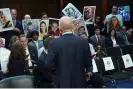  ?? Photograph: Kevin Lamarque/Reuters ?? Dave Calhoun faces families and apologizes for the loss of their loved ones upon his arrival to Senate hearing on Tuesday.