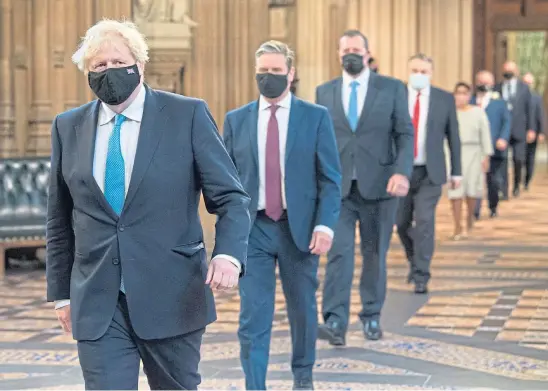  ??  ?? ON PARADE: Boris Johnson leads party leaders to the Queen’s Speech where plans for photo ID at the voting booth were first aired.