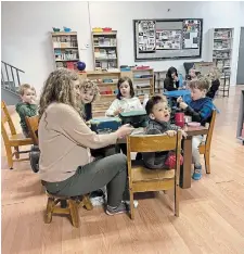  ?? MARK MCNEIL PHOTO ?? Teacher Louise Cervi works with students at Colin Macdonald Community School.