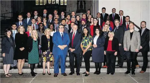  ??  ?? OPENING SHOTS: Jeremy Corbyn, centre, and his deputy Tom Watson gather with newly-elected Labour MPs at Westminste­r yesterday