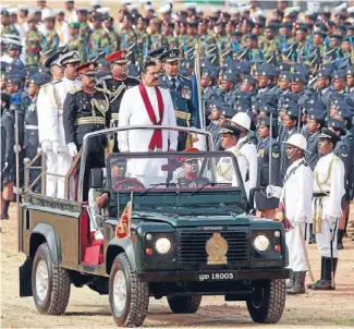  ?? Photo: REUTERS ?? Say no: Sri Lanka’s President Mahinda Rajapaksa in a victory parade. He will chair the Commonweal­th for two years.