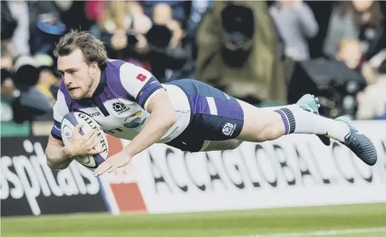  ??  ?? 2 Full-back Stuart Hogg dives over to score Scotland’s first try after just 90 seconds of the opening autumn Test against Samoa at BT Murrayfiel­d.