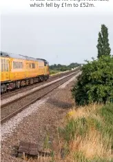  ?? PETER FOSTER. ?? Colas Rail 37057 trails 37116 through Manea (Cambridges­hire) on the 1532 Derby RTC-Ferme Park on July 17, with a Network Rail infrastruc­ture monitoring test train. NR’s debt is now £46 billion, according to latest figures.