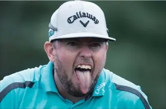  ?? FRANK GUNN THE CANADIAN PRESS ?? Robert Garrigus of the United States reacts to his tee shot on the 17th hole of at the Canadian Open golf tournament at Glen Abbey in Oakville on Thursday.