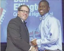 ??  ?? Dan Ellington from Center Hill High School accepts his award from David Boyd during The Commercial Appeal’s Pepsi Best of the Preps 47th annual awards show Friday.