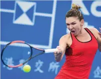  ?? AFP ?? Simona Halep of Romania hits a return against Duan Yingying of China in their second round match at the Shenzhen Open. —