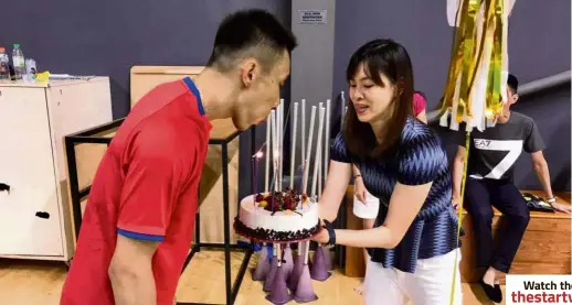  ??  ?? Chong Wei blowing the candles on his birthday cake which was presented by his wife Wong Mew Choo in Odense, Denmark, yesterday. Happy birthday, hubby: Lee