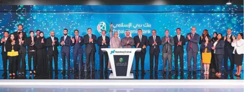  ??  ?? Dubai Islamic Bank (DIB), the largest Islamic Bank in the UAE, rang the market-opening bell yesterday to celebrate the listing of a ■ $750 million (Dh2.75 billion) sukuk on Nasdaq Dubai.