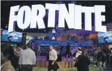  ?? Bloomberg ?? Hit game Fortnite on display at an expo in Los Angeles. Epic Games, its creator, now bypasses Google’s app store