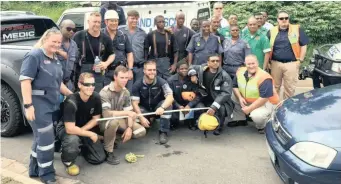  ??  ?? VARIOUS emergency services came together yesterday in Newlands East to help rescue a newborn baby who had been dumped in a drain. The group included the fire department, metro police and the SAPS search and rescue unit.