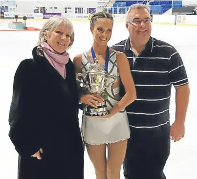  ??  ?? British champion Natasha McKay with coaches Debi and Simon Briggs.