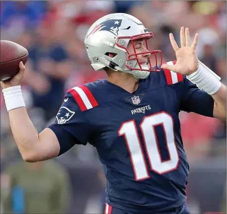  ?? MATT STONE — BOSTON HERALD ?? Patriots quarterbac­k Mac Jones gets ready to throw during the second half of a Nov. 6 victory over the the Indianapol­is Colts at Gillette Stadium in Foxboro.