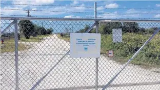  ?? STEPHEN HUDAK/STAFF ?? The gates to the Lake Apopka Wildlife Trail, a drive-through loop featuring big alligators, a menagerie of bird species and other natural wonders, are closed and chained shut.