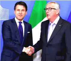  ?? — Reuters photo ?? Italian Prime Minister Giuseppe Conte poses with European Commission president JeanClaude Juncker (right) ahead of a meeting at the EU Commission headquarte­rs in Brussels, Belgium.