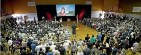  ??  ?? Thousands turned up to the Morrinsvil­le Event Centre for Casey Walker’s funeral, pictured below.
