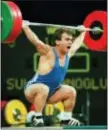  ?? MICHAEL PROBST — THE ASSOCIATED PRESS FILE ?? Naim Suleymanog­lu lifts at the Summer Olympics in Atlanta.