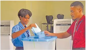  ?? Picture: JONACANI LALAKOBAU ?? Sereani Vueti of Bau Central College puts her ballot paper in the ballot box as polling agent Lesi Maraiwai looks on during the launch of the school election toolkit pilot program at their school in Mokani, Bau, Tailevu yesterday.