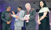  ?? PICTURE: NAAZNEEN ISMAIL ?? Indian Minister of Commerce and Industry and Civil Aviation Suresh Prabhu, second from left, praises Fakir Hassen on the launch of his new book as South African Minister of Trade and Industry, Rob Davies, looks at his copy. On the right is the Indian...