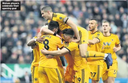  ??  ?? Wolves players celebrate their opening goal