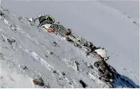  ?? AFP ?? The wreckage of the plane lies near a mountain peak. —