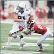  ?? Darron Cummings / Associated Press ?? UConn tight end Jay Rose (91) is tackled by Indiana defensive back Jamar Johnson during a 2019 game in Bloomingto­n, Ind.