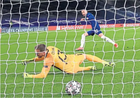 ??  ?? BLUES IN COMMAND: Hakim Ziyech beats Jan Oblak to put Chelsea on course for the last-eight.