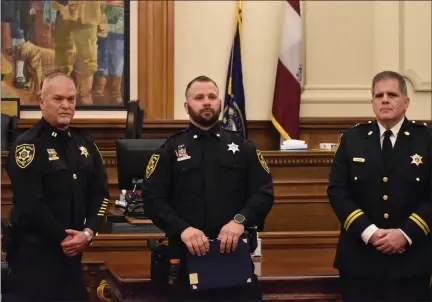  ?? SUBMITTED PHOTO ?? Deputy Cody Brockmeyer, center, is flanked by MCSO Captain Greg Womelsdorf and Sheriff Sean Kilkenny after receiving a life-saving commendati­on.