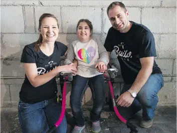  ?? PHOTOS: BRANDON HARDER ?? Liana, Vienna and Jared Kennedy gather in their Massey Road home as renovation­s begin. Vienna has a congenital muscle syndrome and the changes will improve their home’s accessibil­ity.