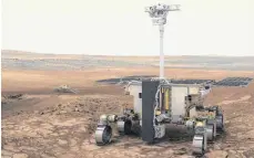  ?? FOTO: ESA/ATG MEDIALAB/DPA ?? Darstellun­g des ExoMars-Rovers der ESA (vorne) und der russischen Wissenscha­ftsplattfo­rm (im Hintergrun­d) auf dem Mars.