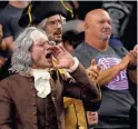  ?? ?? USA fans dressed in colonial garb react during the World Baseball Classic game against Great Britain at Chase Field.