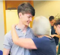  ??  ?? St Christophe­r’s High student James Shuker (A* A A) receives congratula­tions