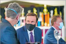  ?? SUSAN WALSH/AP PHOTO ?? Sen. Chris Murphy, D-Conn., attends an event with Vice President Kamala Harris, not pictured, at the Boys & Girls Club of New Haven on Friday.