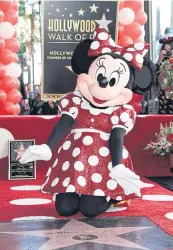  ??  ?? Minnie Mouse attends a ceremony honouring her with a star on the Hollywood Walk of Fame on Monday in Los Angeles.