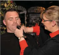  ??  ?? Brenda Byrne takes the shears to David Russell’s moustache and (right) Micheál O’Dowd gives his dad, Denis’s, ‘’ moustache a tweak before it was shaved off in Quinn’s pub, Ventry, on Saturday night to raise funds for the Kerry-Cork Health Link Bus.