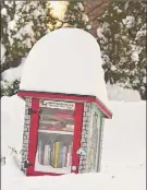  ?? Lori Van Buren / Times Union ?? Two feet of snow managed to cover up a lot of things last week in the Capital Region.