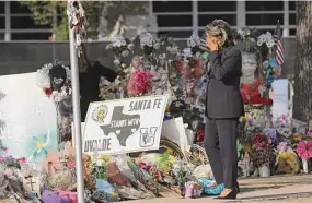  ?? Jerry Lara/Staff photograph­er ?? Texas House committee member Eva Guzman visits the memorial at Robb Elementary on June 17 in Uvalde. Funding announced Tuesday includes nearly $6 million to expand access to therapy.