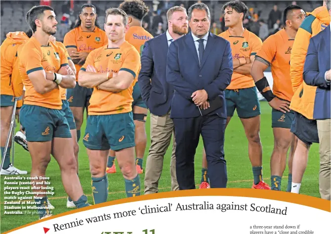  ?? File photo: AFP ?? Australia’s coach Dave Rennie (center) and his players react after losing the Rugby Championsh­ip match against New Zealand at Marvel Stadium in Melbourne, Australia.