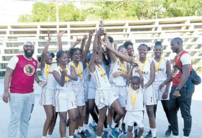  ?? ?? Herbert Morrison Technical High School’s players and coaches celebrate winning the 2024 ISSA Schoolgirl­s’ Rural Basketball competitio­n at the Montego Bay Cricket Club on Friday.