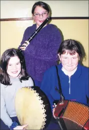  ?? ?? Pupils from Presentati­on Primary School, Fermoy, who took part in the instrument­al section of the North Cork Scór na bPáisti finals in Shanballym­ore in 2001, Sarah Crilly (bodhran), Katie O’Flynn (accordian) and Jenny O’Callaghan (flute).