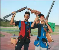  ??  ?? India juniors Vivaan Kapoor (left) and Bhowmeesh Mendiratta, who won the men’s Trap gold and silver, at the Losail Shooting Complex on Thursday.