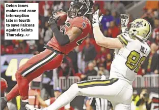  ?? AP ?? Deion Jones makes end zone intercepti­on late in fourth to save Falcons against Saints Thursday.