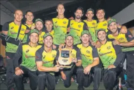  ?? GETTY IMAGES ?? ■ The Australia team with the TriSeries trophy after beating New Zealand on Wednesday.