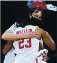  ?? ETHAN MILLER – GETTY IMAGES ?? Coach Tara Vanderveer and Kiana Williams hug after Stanford won the Pac-12 Tournament championsh­ip.